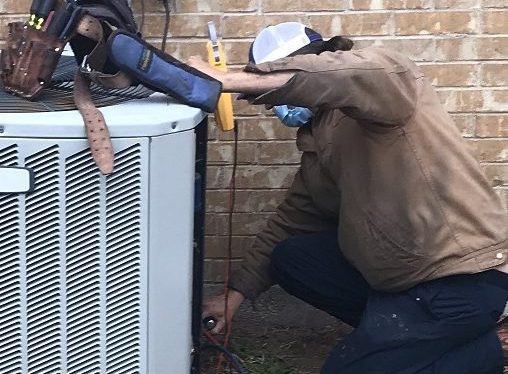HVAC technician works on a Ductless Mini Split system. Mini Split system installation and replacement in Southlake, TX.
